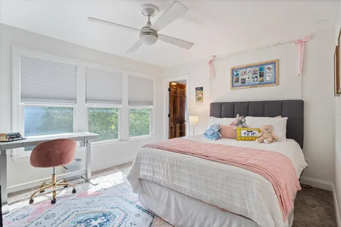 a bathroom with a white bath tub and shower