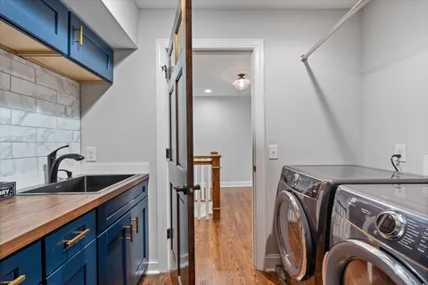 a bathroom with a double vanity sink and a mirror
