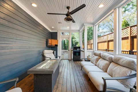 a view of a swimming pool with a patio and a yard