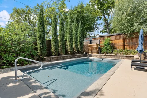 a kitchen with granite countertop a stove and a sink