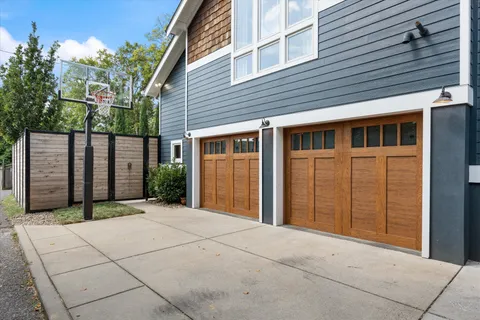 a view of a dining room with furniture a chandelier and wooden floor