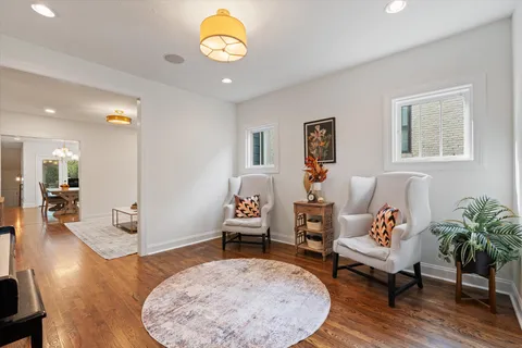 a view of a patio with table and chairs and potted plants