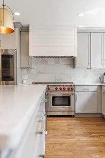 a view of a house with pool and sitting area
