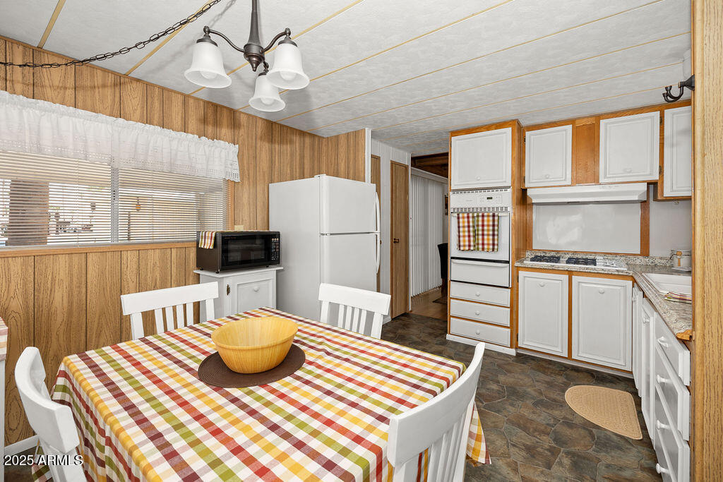 10220 East Apache Trail, Unit 16 Apache Junction, AZ 85120 - Photo 12 of 49 a kitchen with a sink appliances and cabinets