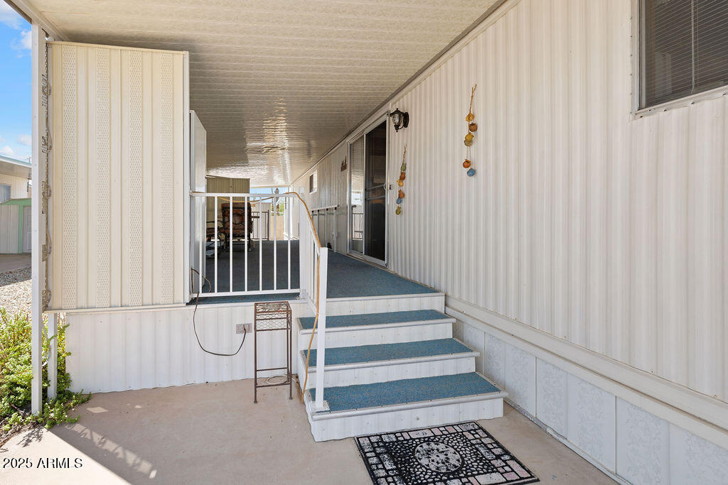 10220 East Apache Trail, Unit 16 Apache Junction, AZ 85120 - Photo 34 of 49 a view of entryway with wooden floor and stairs