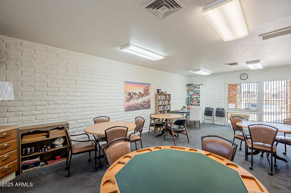 10220 East Apache Trail, Unit 16 Apache Junction, AZ 85120 - Photo 40 of 49 a living room with furniture a rug and a window