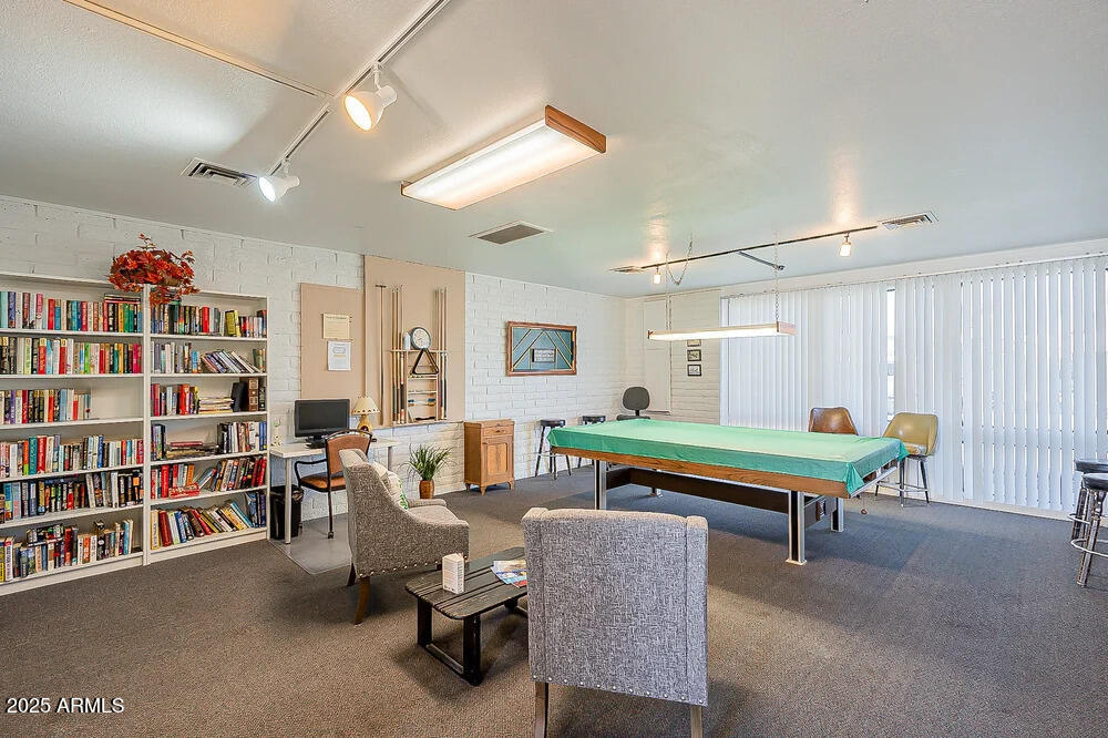 10220 East Apache Trail, Unit 16 Apache Junction, AZ 85120 - Photo 41 of 49 a room with bookshelf furniture and a book shelf