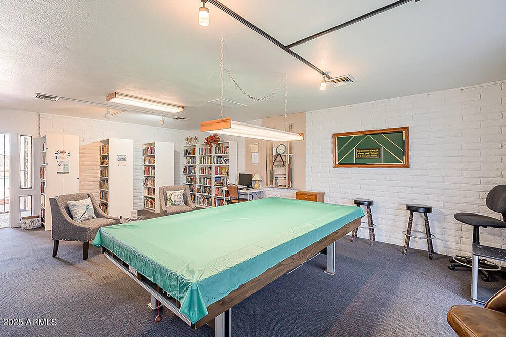 10220 East Apache Trail, Unit 16 Apache Junction, AZ 85120 - Photo 42 of 49 a room with pool table and windows