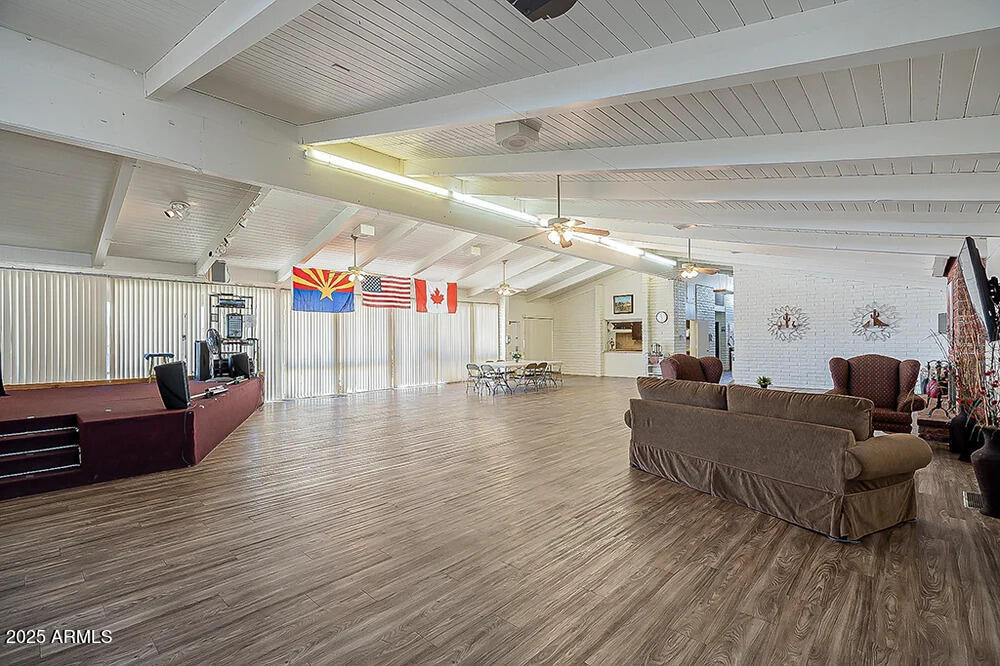 10220 East Apache Trail, Unit 16 Apache Junction, AZ 85120 - Photo 43 of 49 a living room with furniture and wooden floor