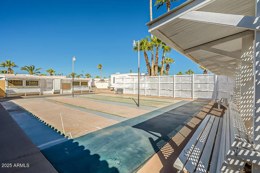 10220 East Apache Trail, Unit 16 Apache Junction, AZ 85120 - Photo 44 of 49 a view of a terrace with wooden floor