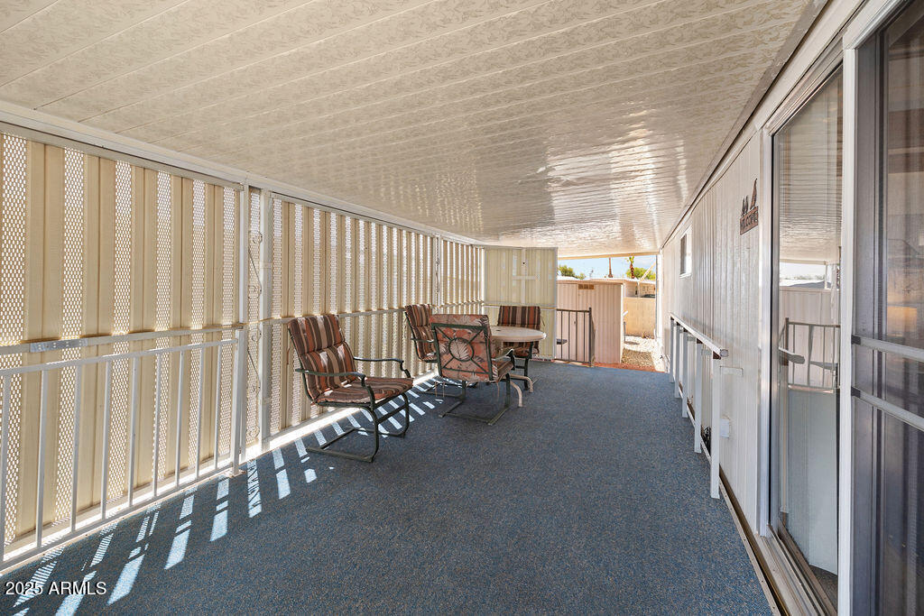 10220 East Apache Trail, Unit 16 Apache Junction, AZ 85120 - Photo 5 of 49 a view of a hallway with seating area