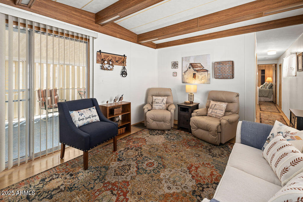 10220 East Apache Trail, Unit 16 Apache Junction, AZ 85120 - Photo 7 of 49 a living room with furniture and a large window