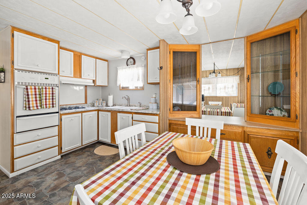 10220 East Apache Trail, Unit 16 Apache Junction, AZ 85120 - Photo 9 of 49 a living room with stainless steel appliances furniture and a large window