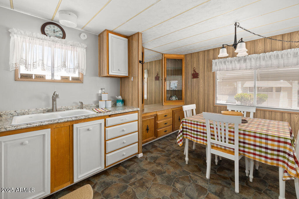 10220 East Apache Trail, Unit 16 Apache Junction, AZ 85120 - Photo 10 of 49 a large kitchen with a table and chairs