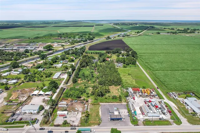 a view of house with backyard space