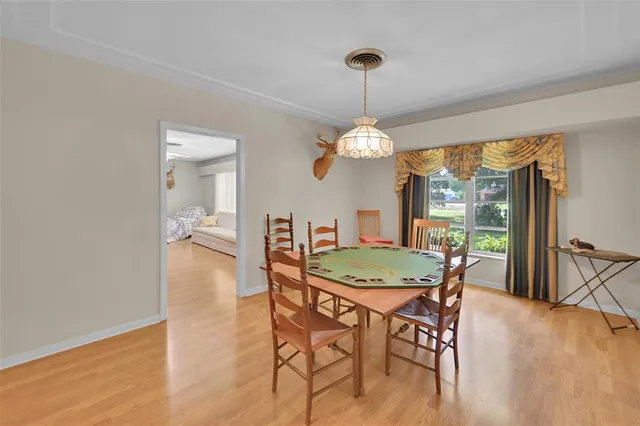 a bathroom with a granite countertop sink toilet a mirror and shower