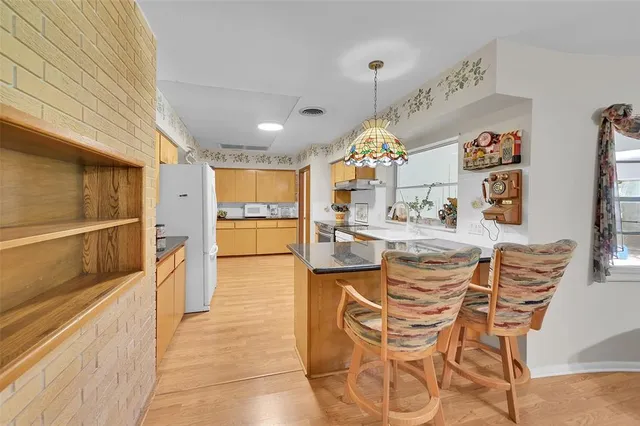 a view of a workspace with furniture