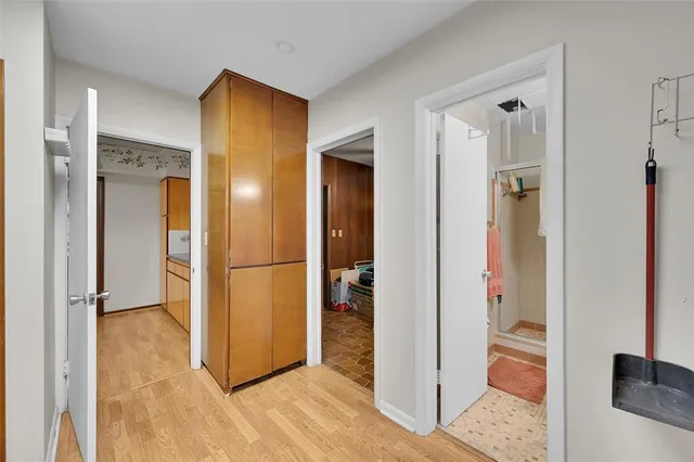 a view of a patio with table and chairs under an umbrella