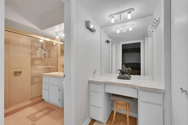 an aerial view of a house with a yard and large trees