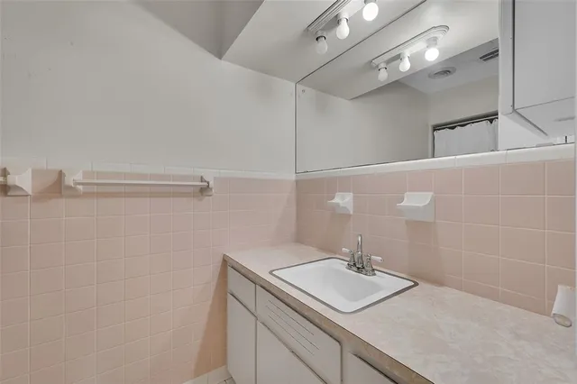 an aerial view of residential houses with outdoor space and street view