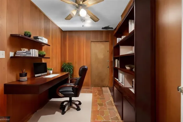 an aerial view of residential houses with outdoor space and street view