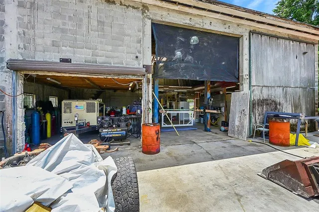 an aerial view of residential house with outdoor space and street view