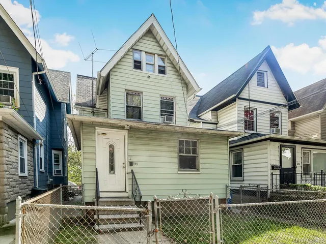 a view of a patio with table and chairs and a fire pit