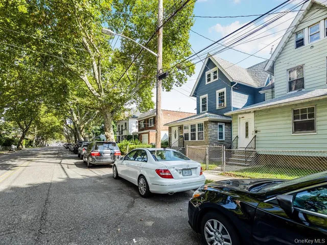 a view of a house with a small yard