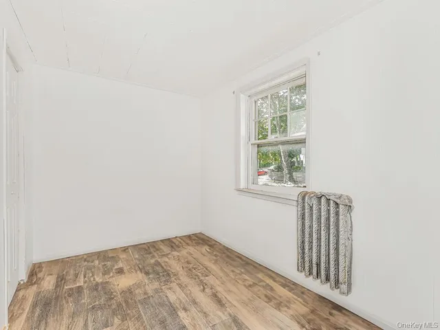 a kitchen with a stove a sink and a window