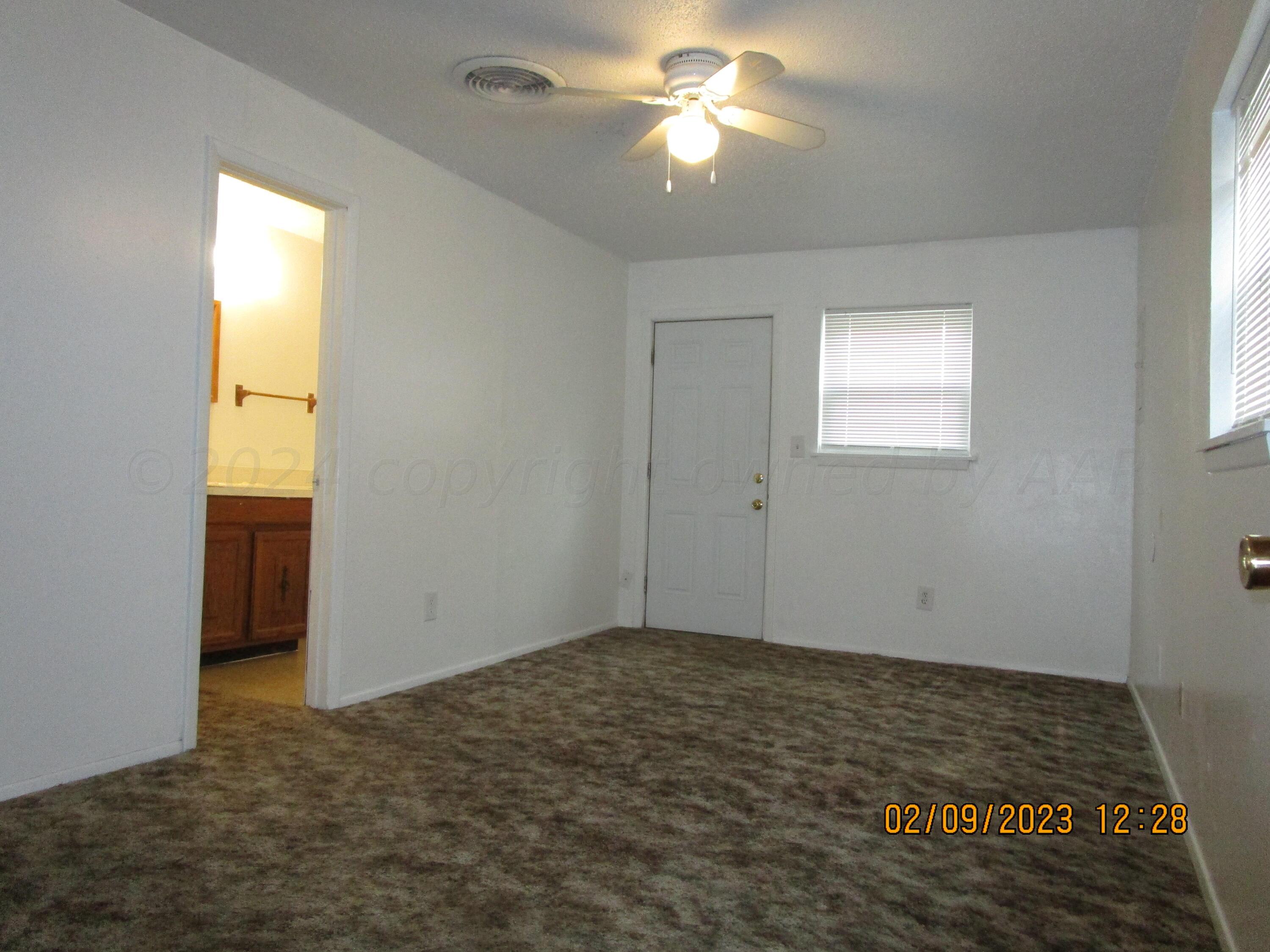 710 Deahl Street Borger, TX 79007 - Photo 4 of 5 a view of an empty room and window