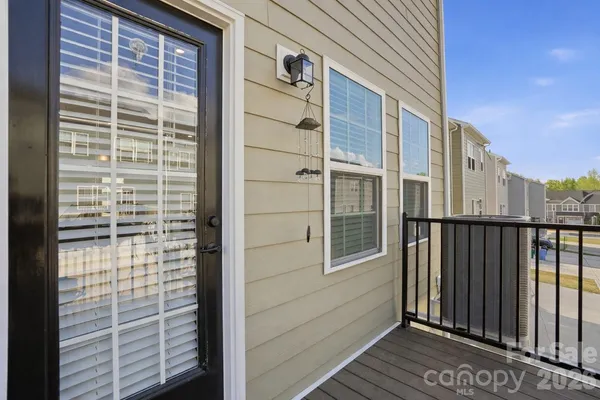 a view of a flower pot with wooden floor and a potted plant