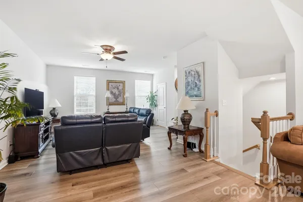 a kitchen with stainless steel appliances granite countertop a sink a stove and a refrigerator