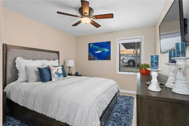 a bedroom with a bed and a lamp