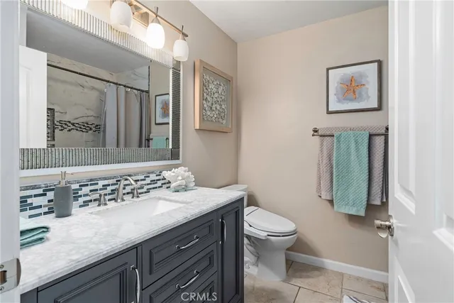 a kitchen with stainless steel appliances granite countertop a stove a refrigerator and cabinets