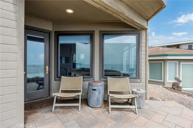 a outdoor space with a couch and chairs