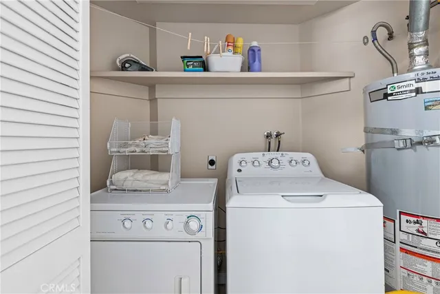 a bedroom with bed and a chandelier