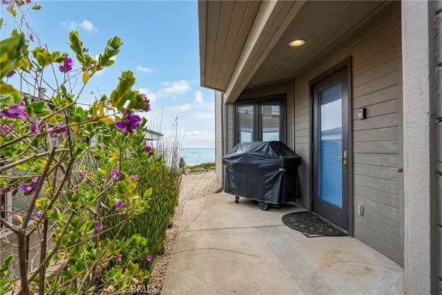 a pathway of a house with a yard
