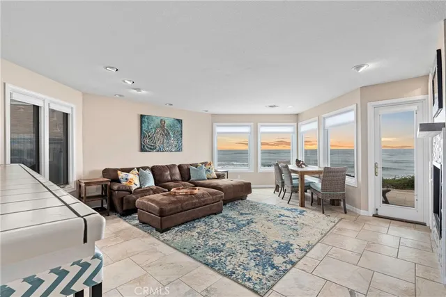 a living room with furniture fireplace and a flat screen tv
