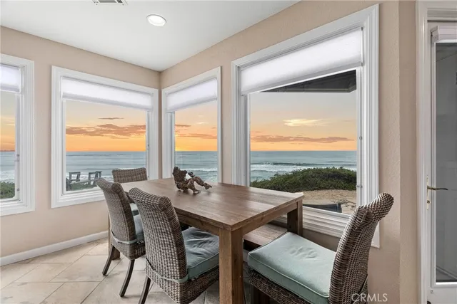 a living room with furniture and large windows