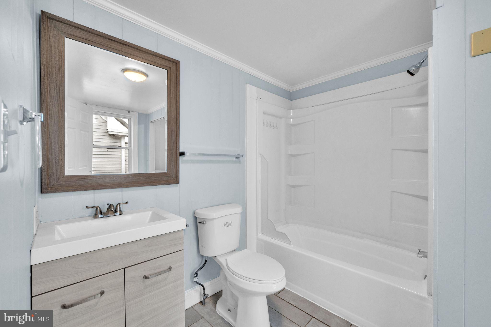 48 Elizabeth Street Hagerstown, MD 21740 - Photo 15 of 48 a bathroom with a bathtub shower sink vanity and toilet