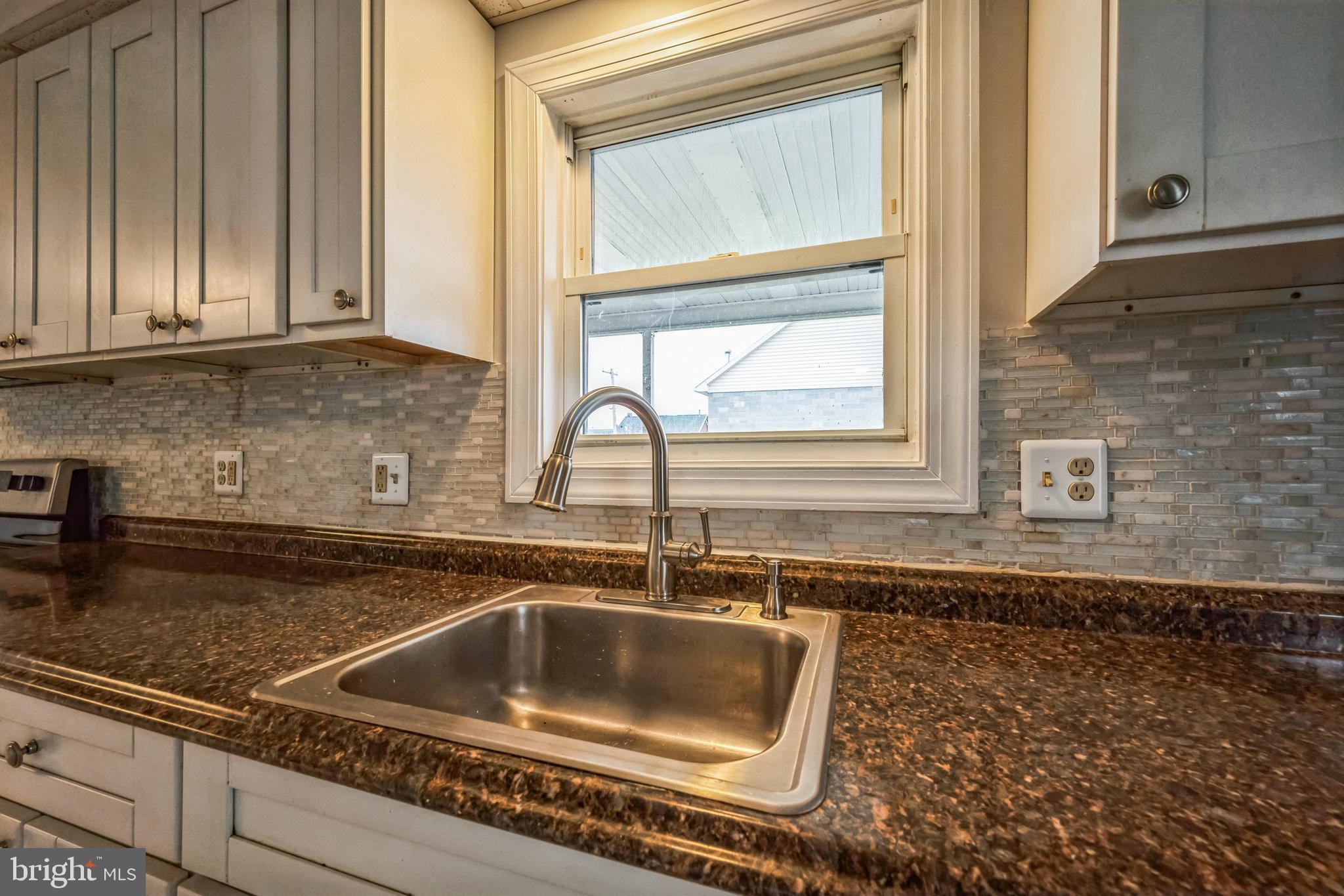 48 Elizabeth Street Hagerstown, MD 21740 - Photo 20 of 48 a kitchen with granite countertop a sink and a window