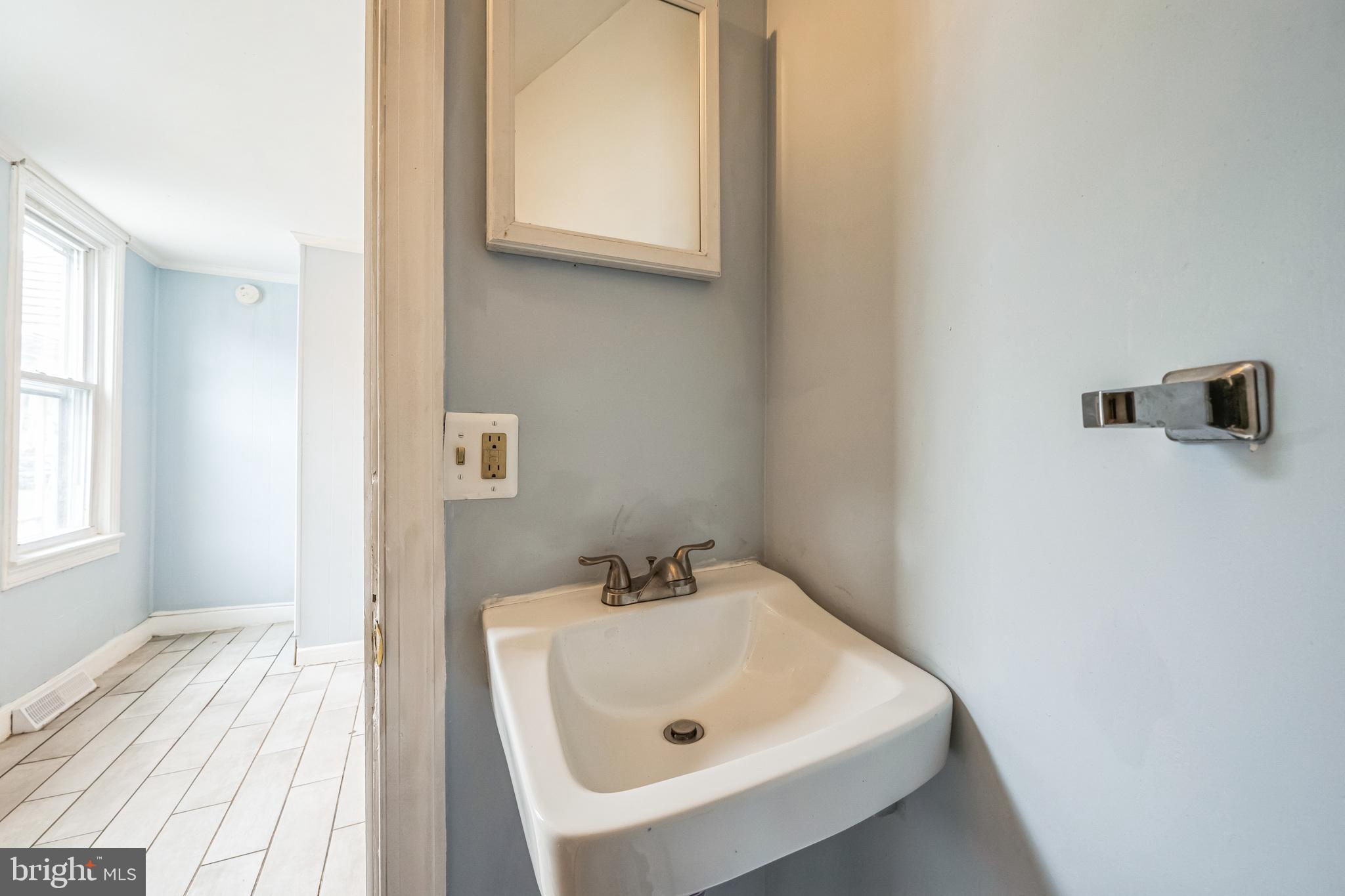 48 Elizabeth Street Hagerstown, MD 21740 - Photo 29 of 48 a bathroom with a sink and a window
