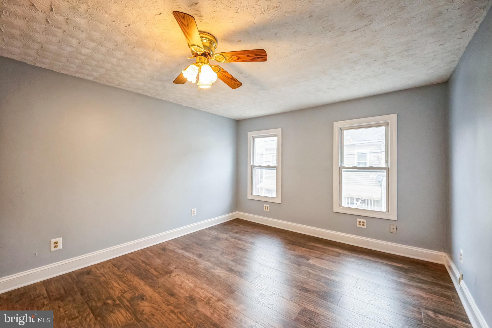48 Elizabeth Street Hagerstown, MD 21740 - Photo 33 of 48 a view of an empty room with wooden floor and a window