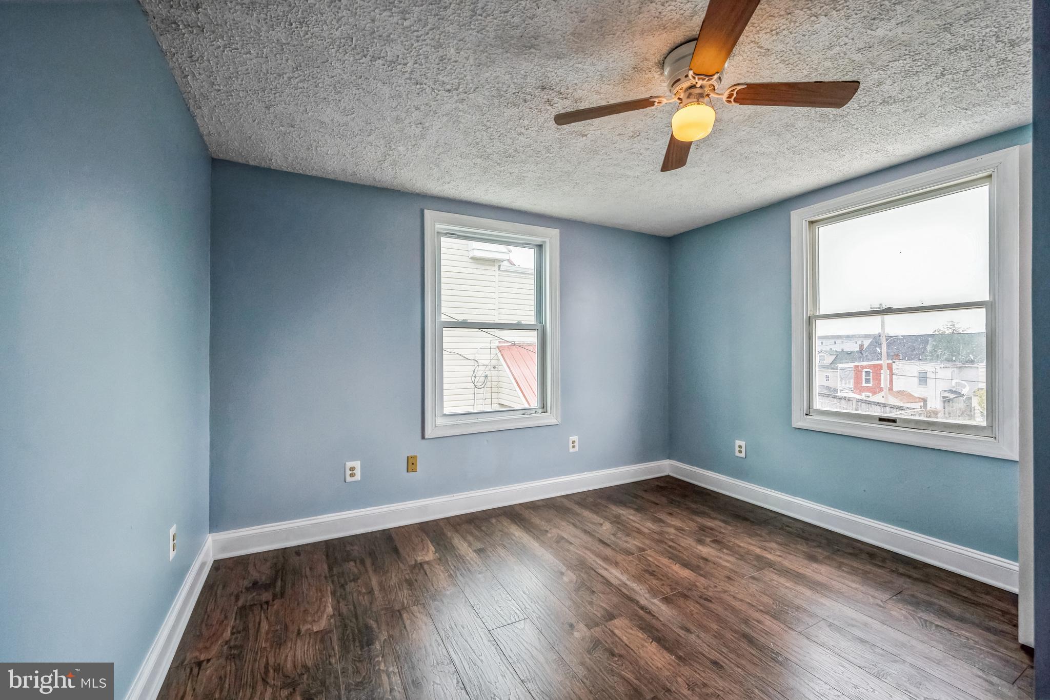 48 Elizabeth Street Hagerstown, MD 21740 - Photo 34 of 48 an empty room with a window and wooden floor