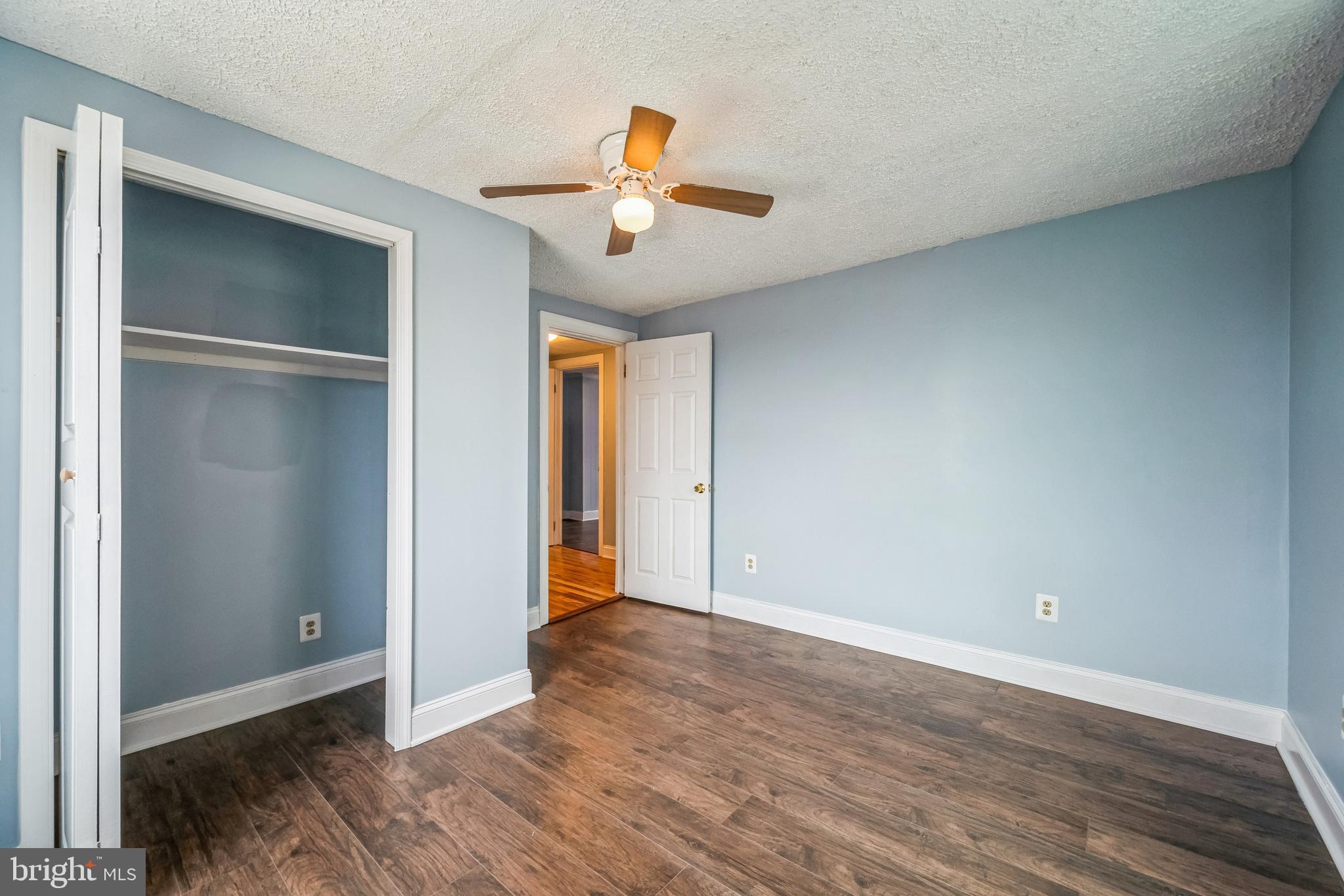 48 Elizabeth Street Hagerstown, MD 21740 - Photo 36 of 48 a view of an empty room with wooden floor