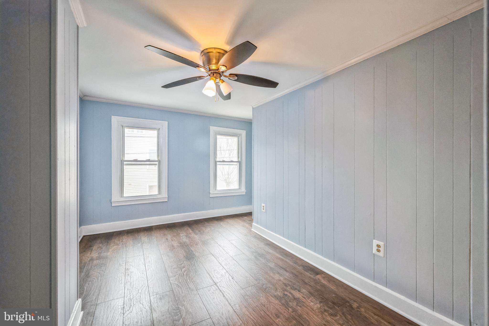 48 Elizabeth Street Hagerstown, MD 21740 - Photo 39 of 48 a view of an empty room with wooden floor and a window