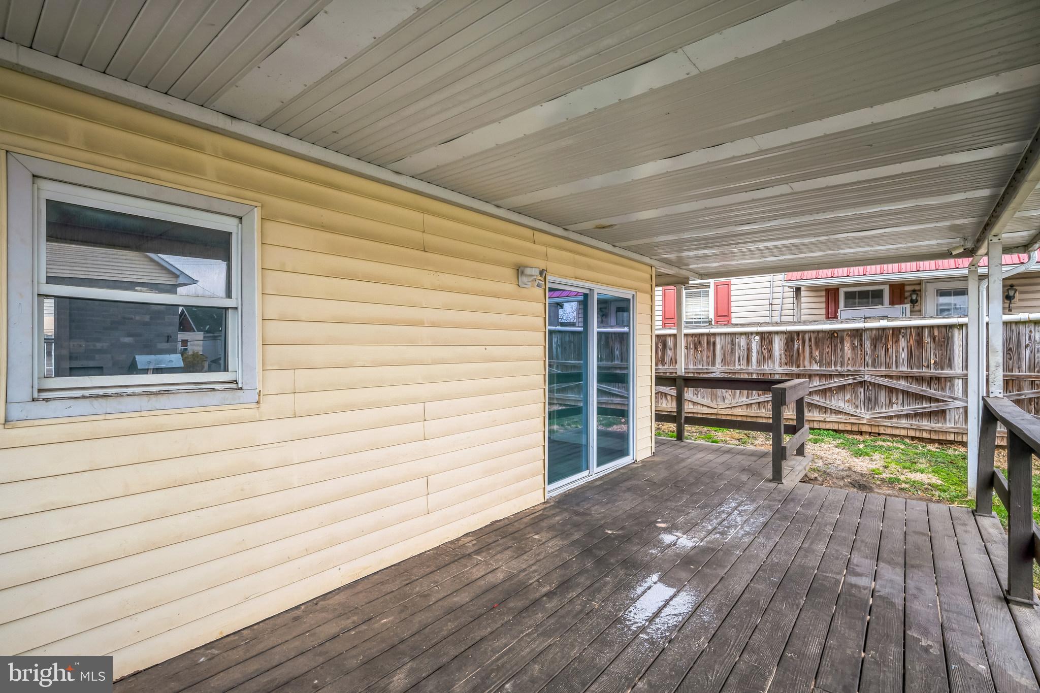 48 Elizabeth Street Hagerstown, MD 21740 - Photo 4 of 48 a view of a deck with wooden floor and bench