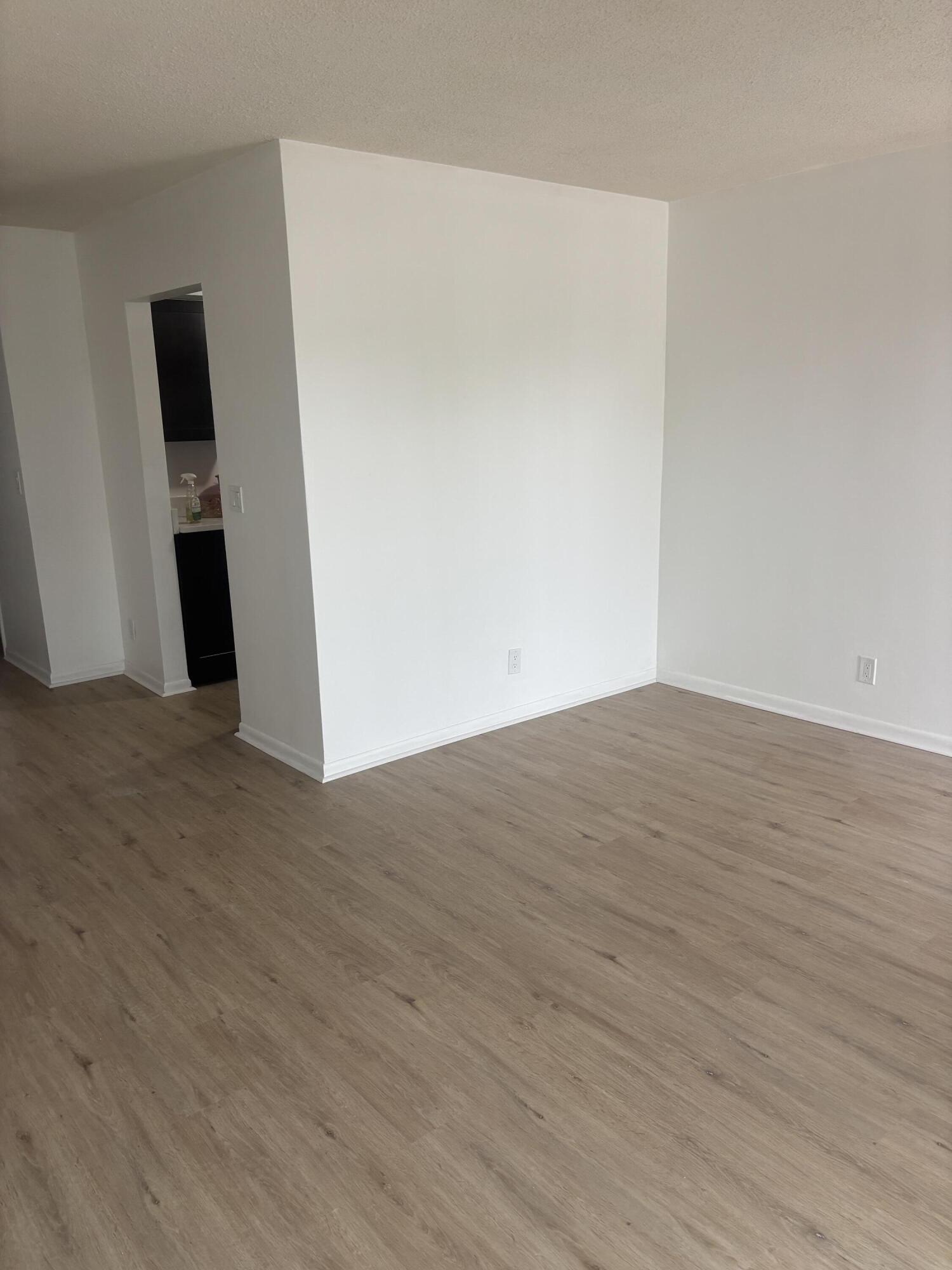 521 Northeast 45th Street Boca Raton, FL 33431 - Photo 7 of 17 a view of a room with wooden floor