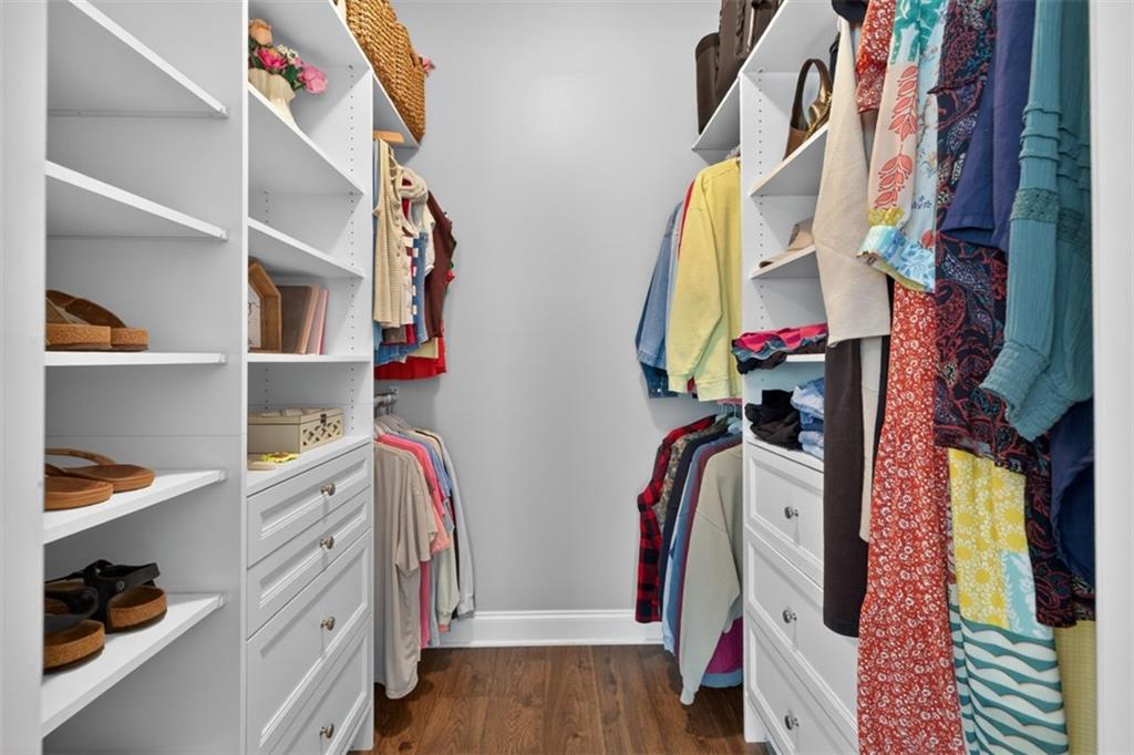 163 Hewett Road Pendergrass, GA 30567 - Photo 48 of 82 a view of walk in closet with clothes and shoes