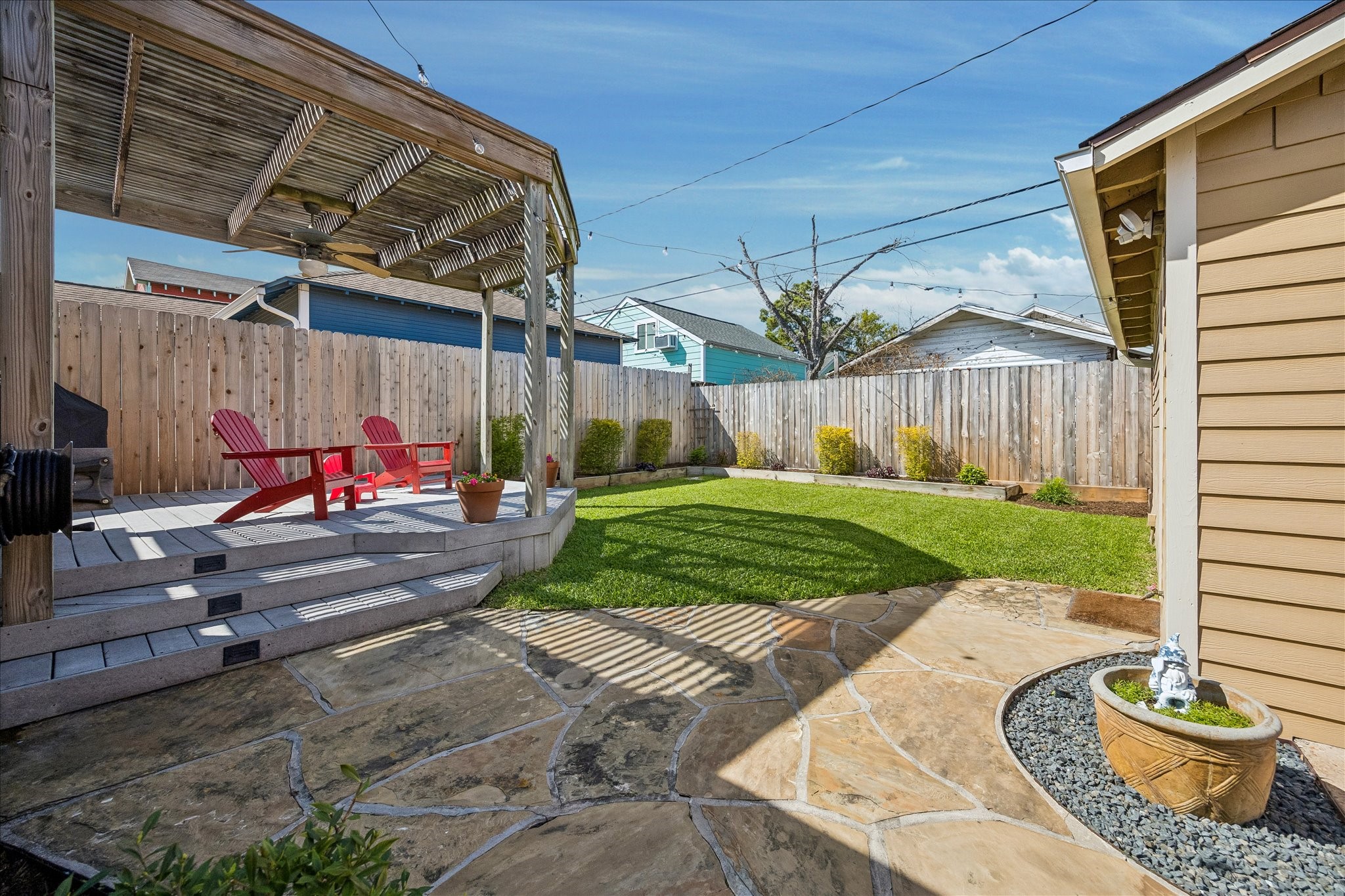 919 Key Street Houston, TX 77009 - Photo 25 of 39 Stone pathway leads from wooden deck, past beautiful backyard, to the two-card garage.